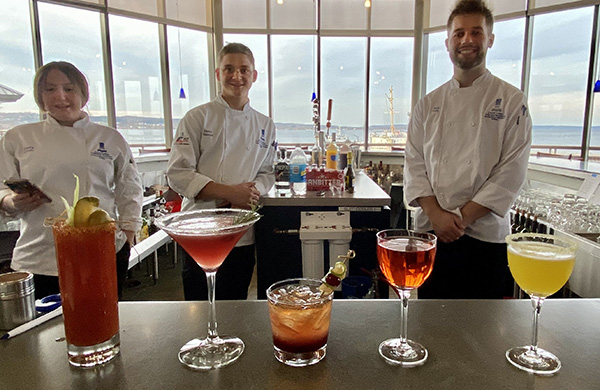 Culinary students enrolled in the new Beverage Management class show off cocktails