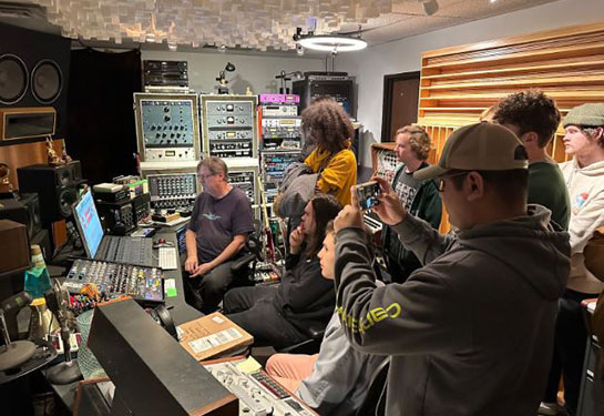 NMC Audio Technology program students view a music production studio in East Lansing