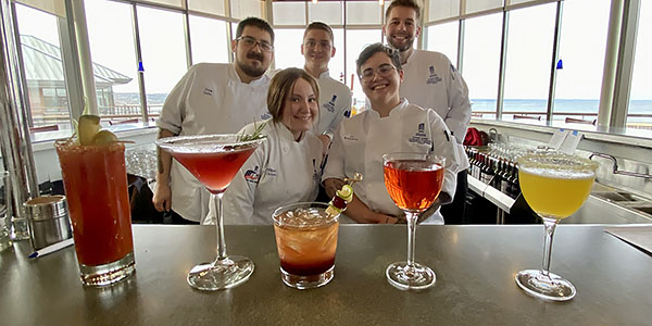 Students in the Great Lakes Culinary Institute's beverage management class show off their creations at Lobdell's Teaching Restaurant