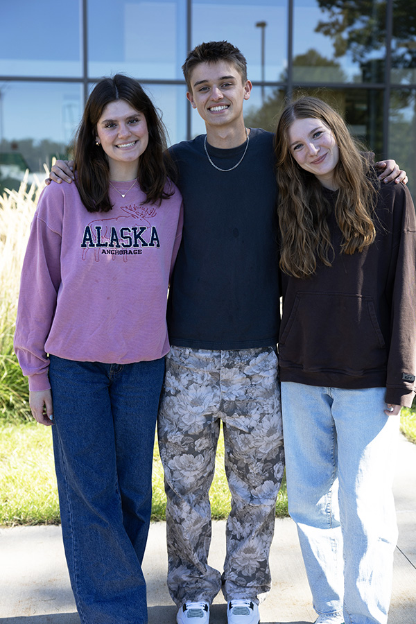 Three NMC Early College students standing outside the Timothy J. Nelson Innovation Center