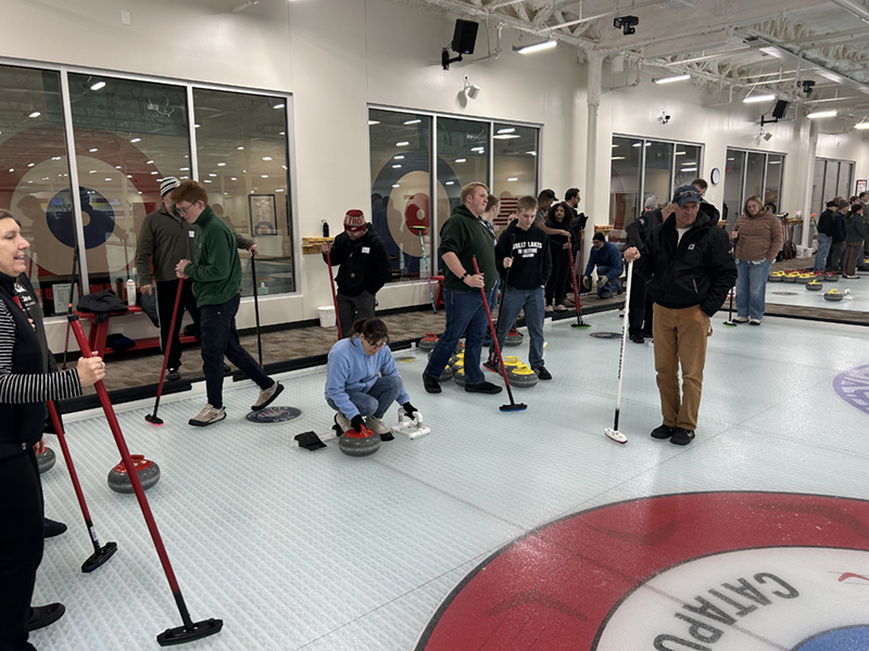 NMC students and employees learning to curl