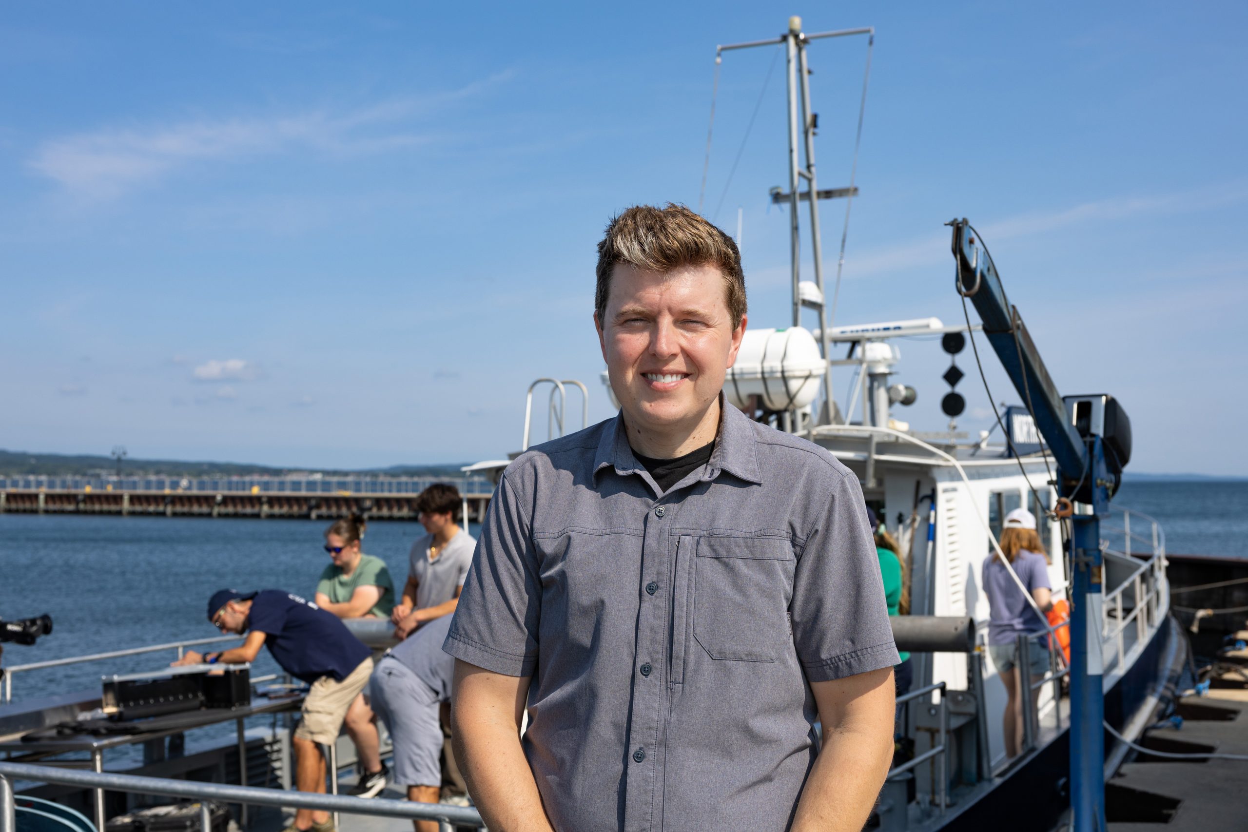 John Lutchko in front of the R/V Northwestern