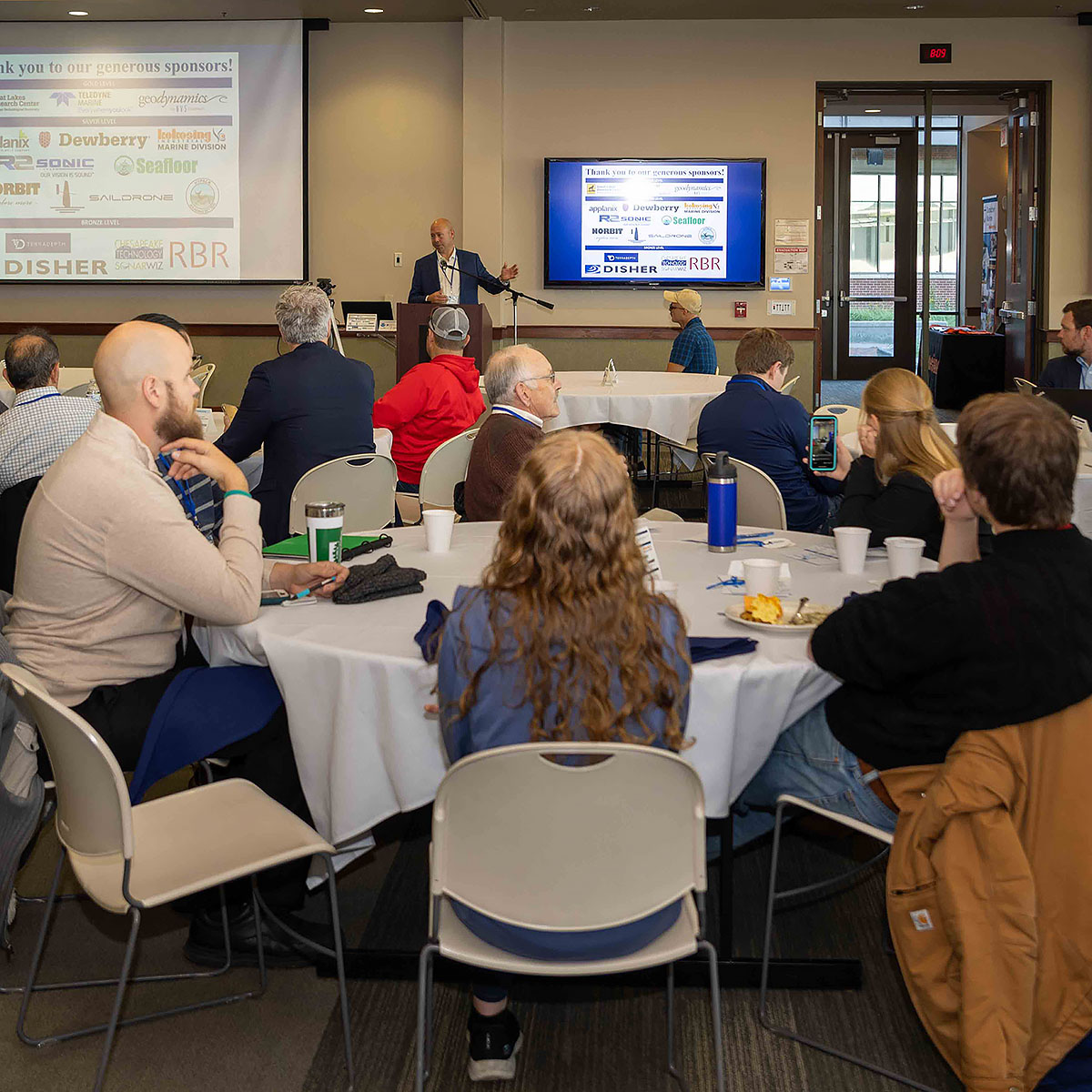 Hans VanSumeren, Senior Director of the Ocean Enterprise Initiative and Marine Technology Society and the founding director of NMC's Great Lakes Water Studies Institute, speaks at a Lakebed 2030 event in 2022